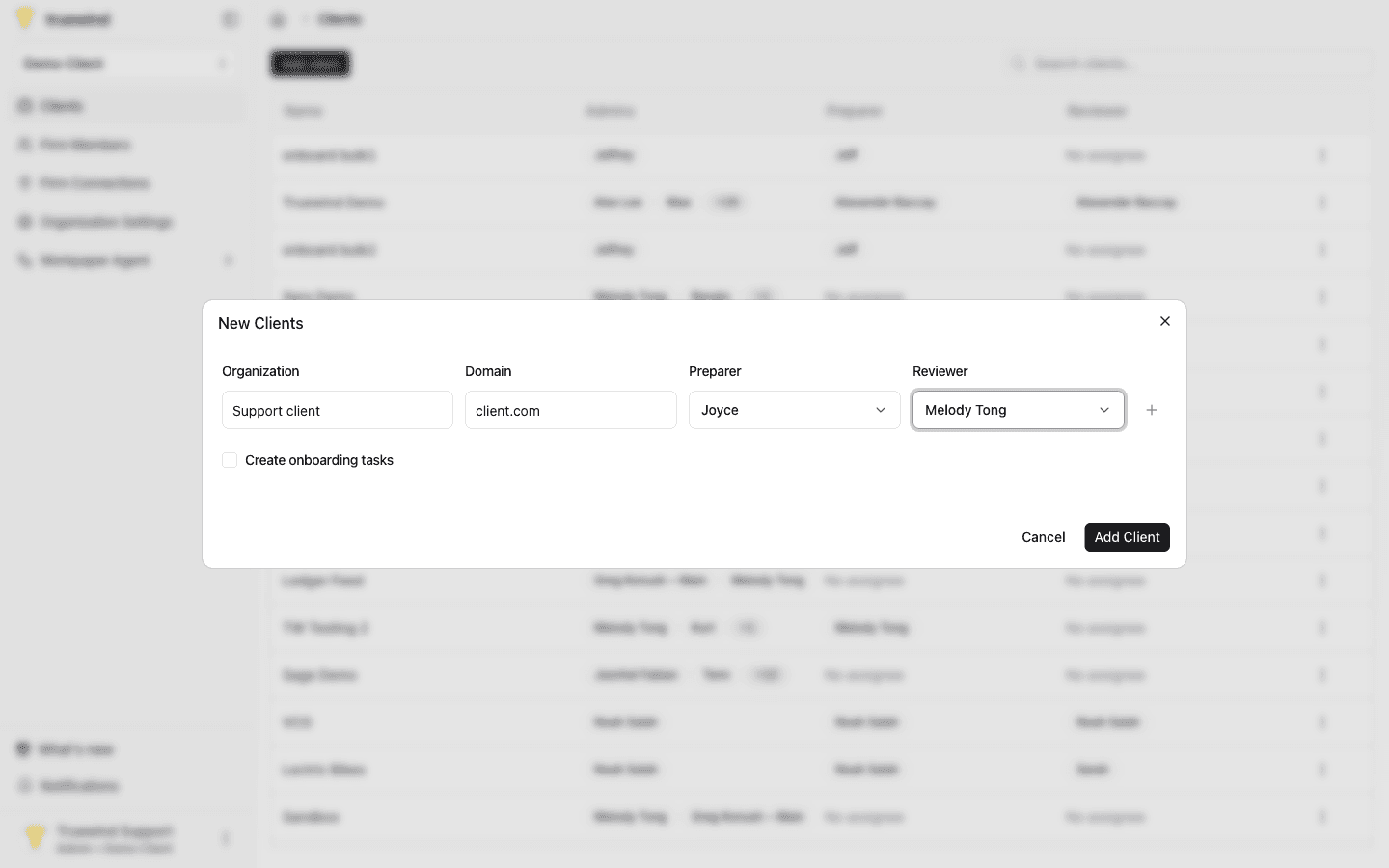 Screenshot showing the Add client form with client details, required organization name and primary Preparer fields, optional domain, reviewer, onboarding task options, and the Add client button